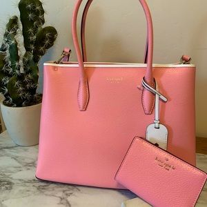 Pink Kate Spade purse with white trim and strap with matching wallet